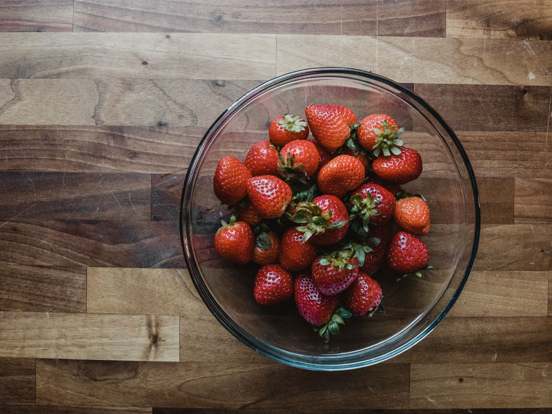 Florida strawberries Fresh red Florida strawberries in a bowl on a clean butcher block